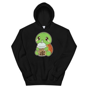 May include: Black hoodie with a cartoon illustration of a green turtle wearing a brown shell and drinking a boba tea with a green straw.