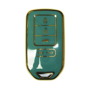 May include: A teal car key with gold trim and buttons. The buttons have symbols for lock, unlock, boot, and hold.