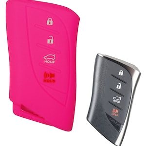 May include: A pink silicone key fob cover for a car key with four buttons. The buttons are labeled "Hold" and have icons for lock, unlock, trunk release, and panic.