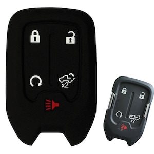 May include: Black silicone key fob cover with four buttons: lock, unlock, trunk release, and panic. The cover is designed to fit a key fob with a red panic button.