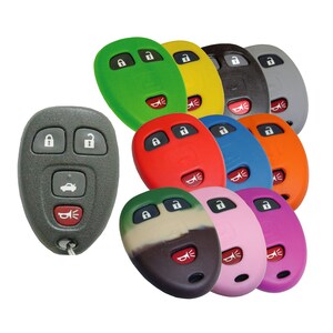May include: Assortment of 10 silicone key fob covers in various colors, including green, yellow, red, blue, orange, camouflage, pink, and gray. The covers are designed to fit a standard car key fob with four buttons.