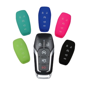 May include: A set of six silicone key covers for car keys. The covers are in blue, green, pink, black, and two shades of green. The covers are designed to protect the car keys from scratches and wear.