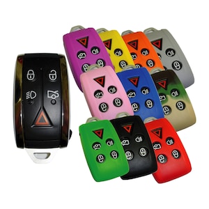 May include: A set of ten silicone key covers in various colors, including pink, purple, green, blue, black, red, yellow, orange, gray, and camouflage. The covers are designed to fit a car key fob with six buttons.