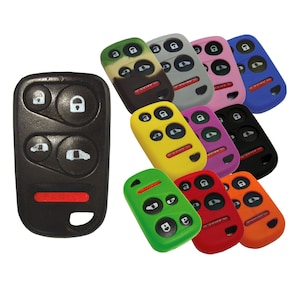 May include: Assortment of colorful silicone key covers for car key fobs. The covers are in various colors, including green, red, orange, yellow, purple, black, gray, blue, and camouflage. The covers are designed to protect the key fob from scratches and wear.