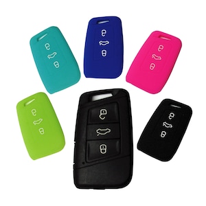 May include: Six silicone key covers in different colors: blue, green, pink, black, and two shades of turquoise. The covers are designed to fit over car key fobs.