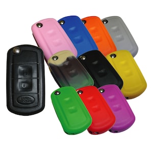 May include: A set of 10 silicone key covers for a Land Rover key fob. The covers are in various colors, including pink, blue, green, red, yellow, and purple.