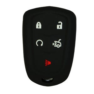 May include: Black car key fob with white icons for lock, unlock, panic, and remote start. The fob has a red light indicator at the bottom.