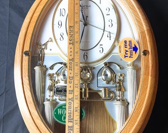 Small World Solid Oak Musical Motion Clock Musical Motion Clock