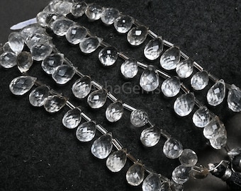 May include: A strand of clear faceted teardrop crystal beads. The beads are strung on a silver wire and are approximately 10mm in size.