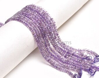 May include: A strand of amethyst gemstone beads, faceted and with a light purple hue. The beads are strung on a thin wire and are approximately 4mm in size.