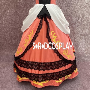 May include: A coral-colored dress with black lace trim and yellow embroidered accents. The dress features a white and black bodice and the text "S O R DCOSPLAY".