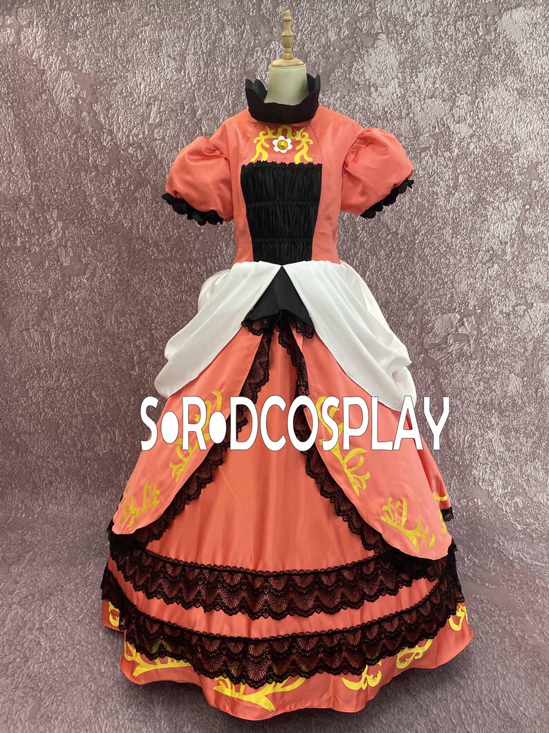 May include: A coral-colored cosplay dress with black and white accents. The dress features a high collar, puffed sleeves, and a layered skirt with black lace trim. The text "SORDCOSPLAY" is printed on the skirt.