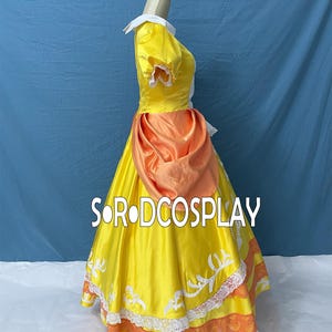 May include: A yellow satin dress with white lace trim and an orange sash. The dress features short sleeves, a white collar, and the text "SORODCOSPLAY" in white across the skirt. The dress is displayed on a mannequin.