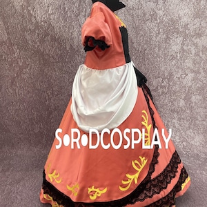 May include: A coral-colored cosplay dress with black lace trim and gold accents. The dress features a high collar, puffed sleeves, and a white apron-like detail. The text "S.OR.DCOSPLAY" is printed on the skirt.