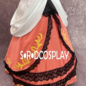 May include: A coral-colored dress with black lace trim and yellow accents. The dress features a white draped fabric over the shoulders and the text "S.R.ODCOSPLAY" in white. The dress appears to be a costume.
