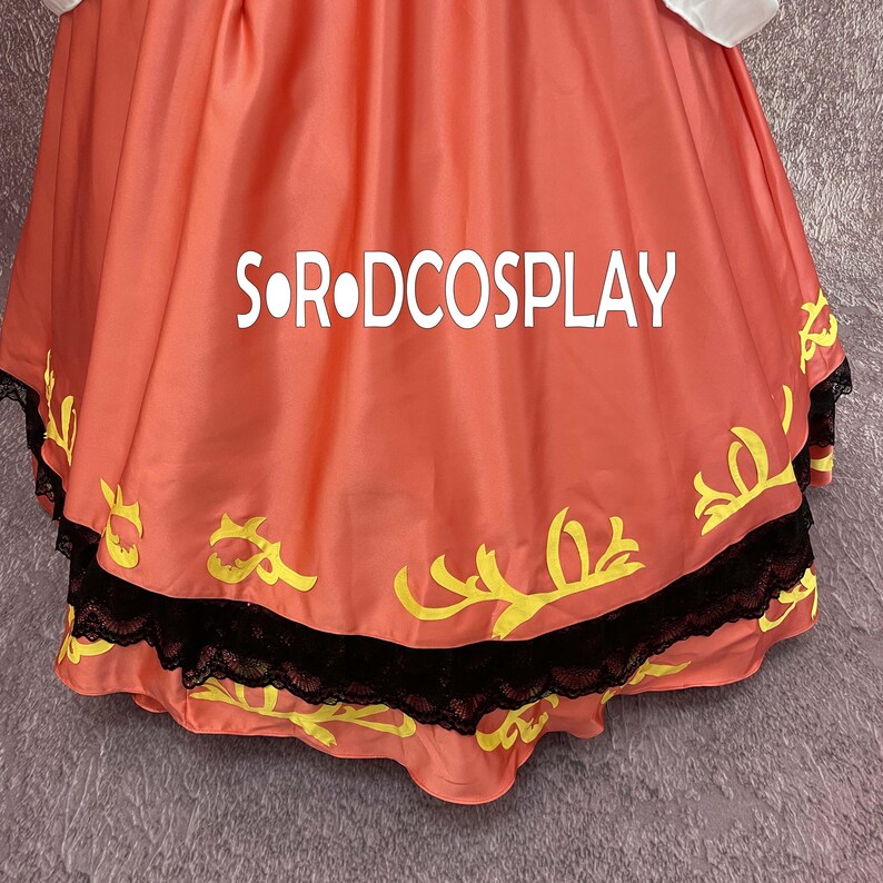 May include: A close-up of a coral-colored garment with the text "S&bull;R&bull;DCOSPLAY" in white. The garment has yellow decorative elements and a black lace trim along the bottom edge. The fabric is gathered and flowing.