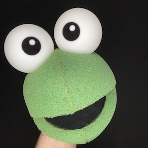 May include: A handmade wooden sign with the text "Welcome" in a handwritten style. The sign is painted white with a distressed finish and features a decorative floral design. It measures approximately 12 inches wide and 6 inches tall.