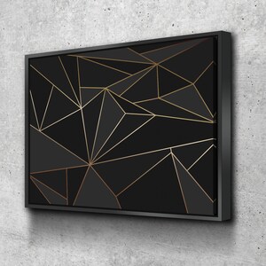 May include: Black and gold geometric canvas wall art with a modern abstract design.