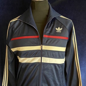 Adidas first tracksuit best sale