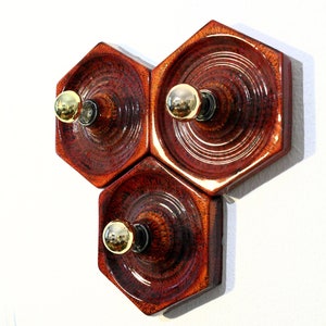 A fiery red ceramic hexagonal wall light from the German manufacturer Hustadt from the 1960s