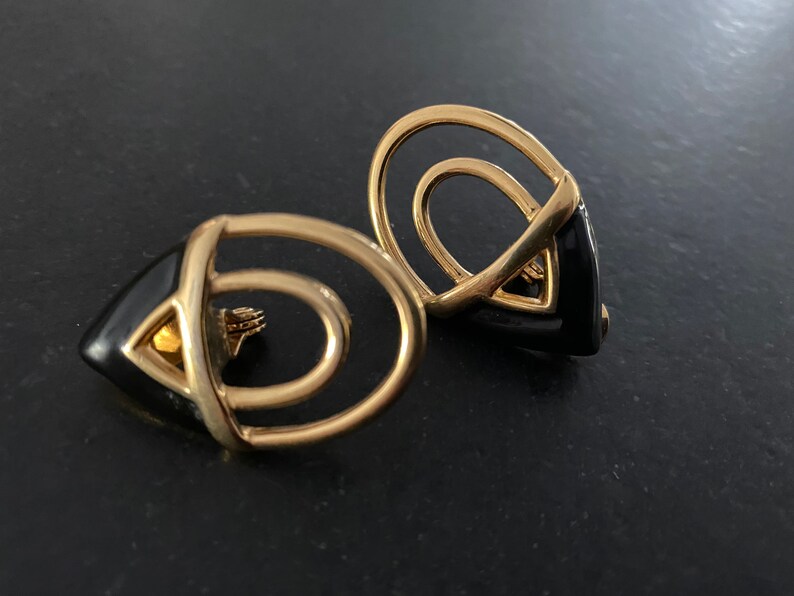 Signed Monet Abstract Gold Tone Earrings. Black Enamel Golden Metal Open Work Statement Earrings Vintage Monet Large Clip On Earrings