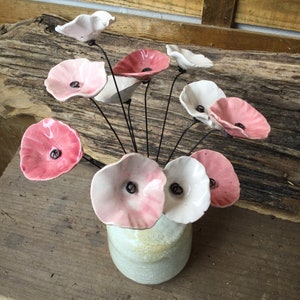 10 small white, pale pink, pink and old pink ceramic flowers on wire