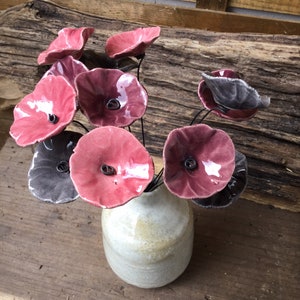 12 small dark gray, plum and old pink ceramic flowers on wire