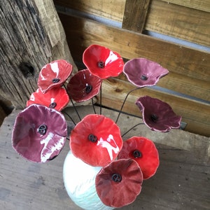 10 small poppy red, dark red and plum ceramic flowers on wire