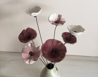 7 small marbled plum-white, plum and white ceramic flowers on wire