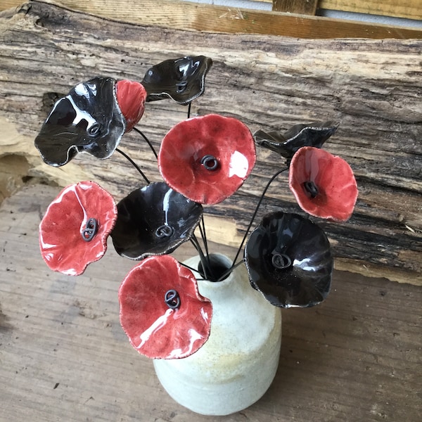 10 small dark red and black ceramic flowers on wire