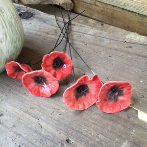 5 small red flowers with dark hearts, poppies, in ceramic on wire for decoration