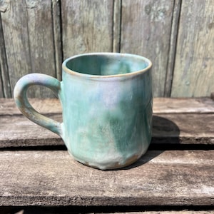 Cup, in turquoise blue, green and pink enameled stoneware for tea or coffee, handcrafted
