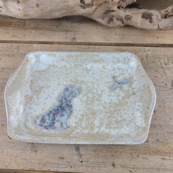 small square dish or tray in enameled stoneware, white and purple tones, dog motif