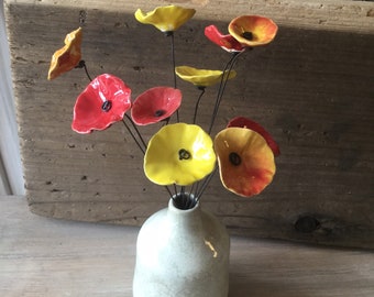 10 small red, yellow and yellow/red ceramic flowers on wire