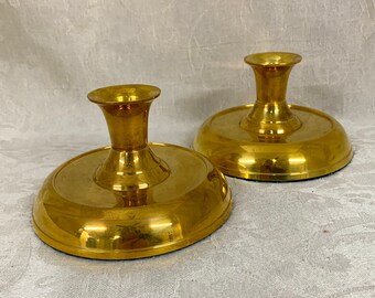 Pair of brass candle sticks for mood lighting; brass candleholder