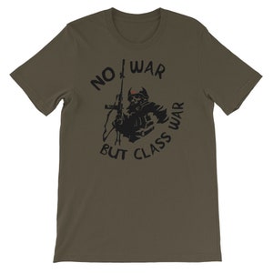 May include: A dark green t-shirt featuring a black graphic of a soldier holding a rifle. The graphic is surrounded by the text "NO WAR BUT CLASS WAR".