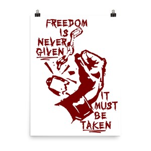 May include: Red and white graphic print of a fist breaking a chain with the text "Freedom is never given it must be taken".