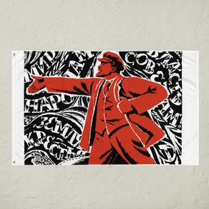 May include: A red flag featuring a stylized illustration of a man in a coat and cap, pointing with his left arm. The background is black and white with abstract text.