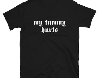 May include: Black t-shirt with white text that reads "my tummy hurts" in a gothic font.
