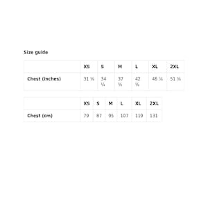 May include: A size guide for clothing, with chest measurements in inches and centimeters. Sizes range from XS to 2XL. Chest measurements in inches range from 31 ⅛ to 51 ⅝. Chest measurements in centimeters range from 79 to 131.