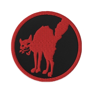May include: Red embroidered patch with a black background featuring a red silhouette of a cat with its back arched and its tail raised. The cat is facing left and has a menacing expression.