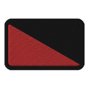 May include: A black and red fabric patch with a diagonal line dividing the patch in half. The top half is black and the bottom half is red.