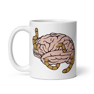 May include: White ceramic mug with a graphic of a brain with worms crawling on it.
