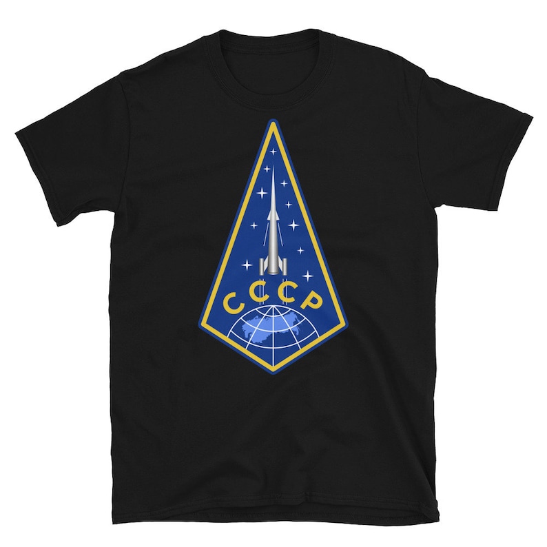 May include: Black t-shirt with a blue and yellow emblem featuring a rocket and the text "CCCP".