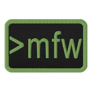 May include: Green embroidered patch with a black background. The patch features the text ">mfw" in a green font.