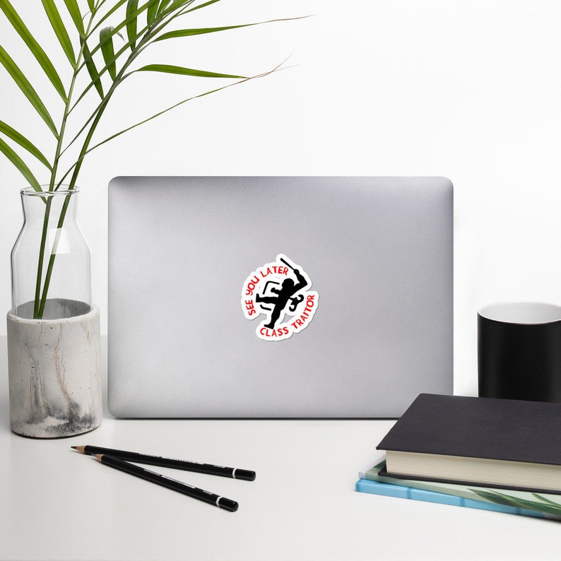 May include: A black and white sticker with a silhouette of a person holding a baseball bat. The text around the person reads "See You Later Class Traitor".