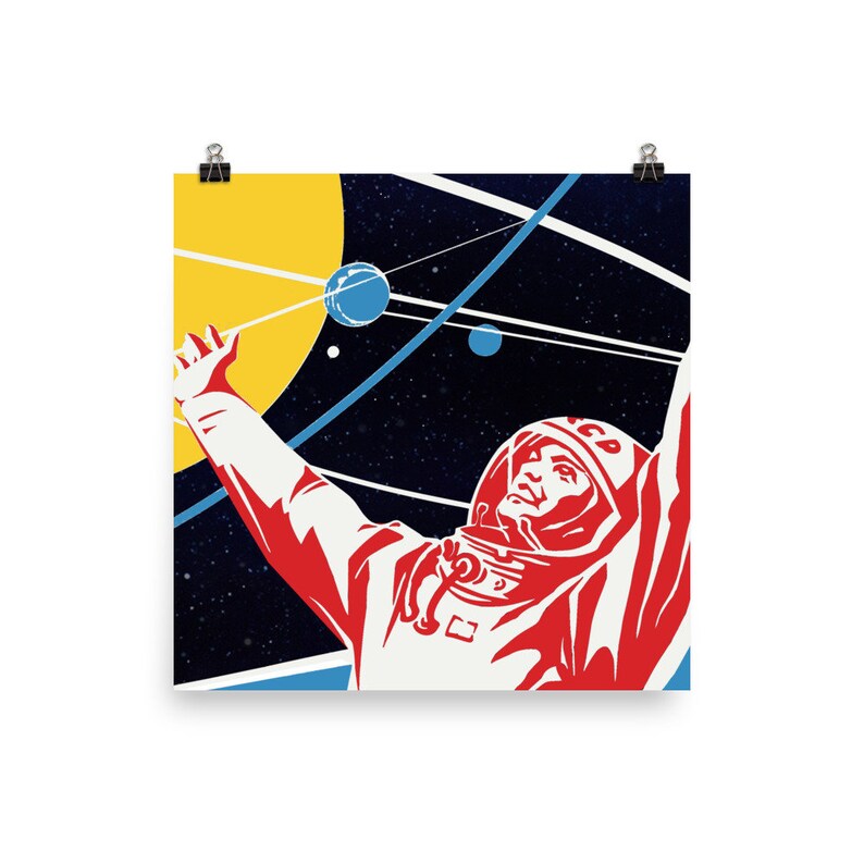 May include: A retro-style poster featuring a stylized illustration of an astronaut in a red and white spacesuit, with a yellow sun and blue planets in the background. The astronaut is reaching up towards the sky, with the text "CCCP" on their helmet.