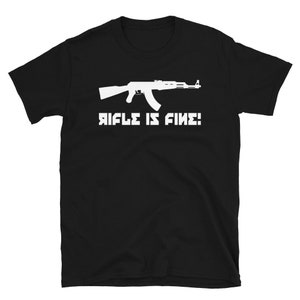 May include: Black t-shirt with a white silhouette of an assault rifle and the text "RIFLE IS FINE!"