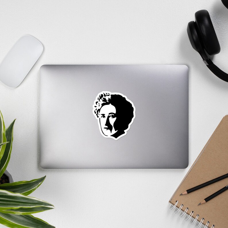 May include: Black and white silhouette of a person with curly hair. The person's face is partially obscured by the hair.