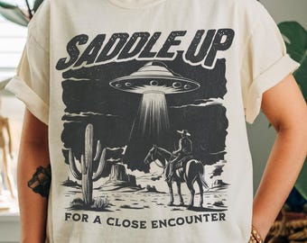 Vintage UFO Western T-Shirt: Retro Space Cowboy Graphic Tee